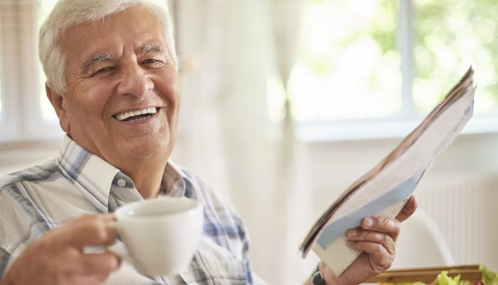 A resident drinking coffee at The Groves at Oak Ridge in Oak Ridge, Tennessee