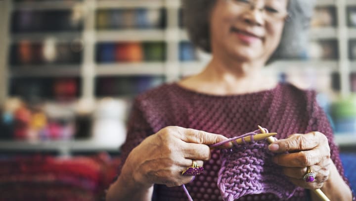 A woman knitting.