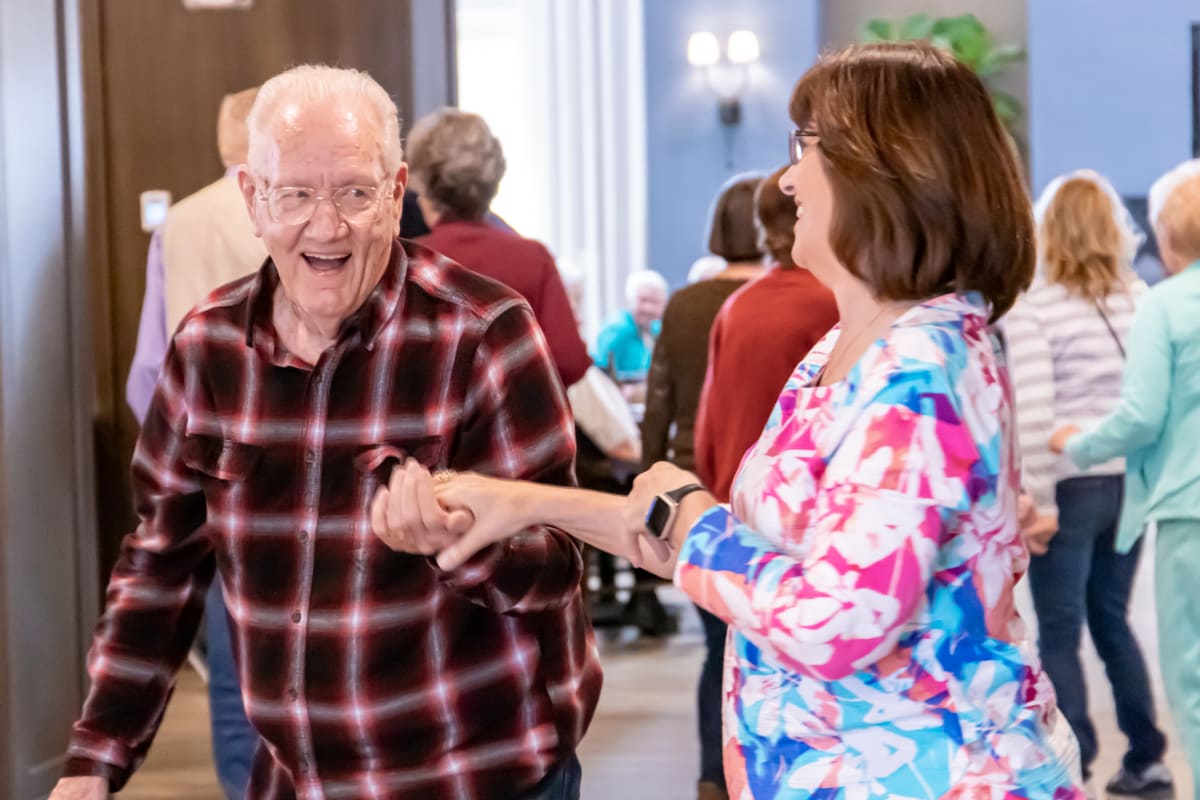 Resident dancing at Watermere at Flower Mound in Flower Mound, Texas