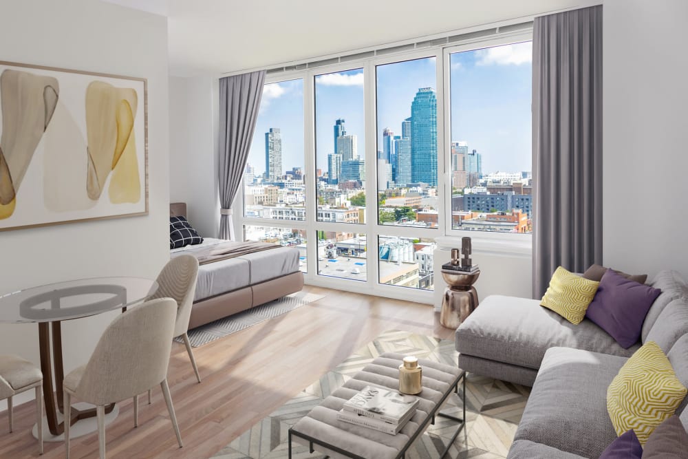 Spacious living area with a gorgeous view at The Maximilian in Queens, New York