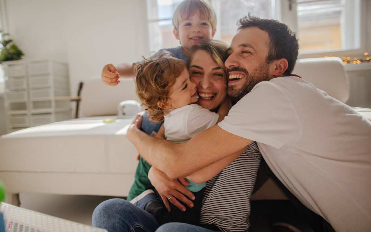 Resident family in their apartment at West Village Apartments in Hillsborough, North Carolina