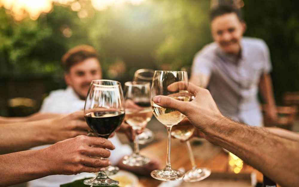 A group of residents toasting their glasses at Creekwood Place in Lancaster, Texas