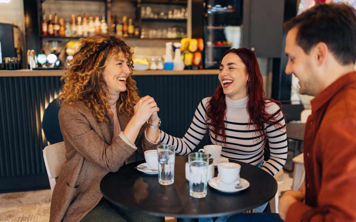 Residents having coffee at a cafe near Lakewood Manor Apartments in Rochester, New York