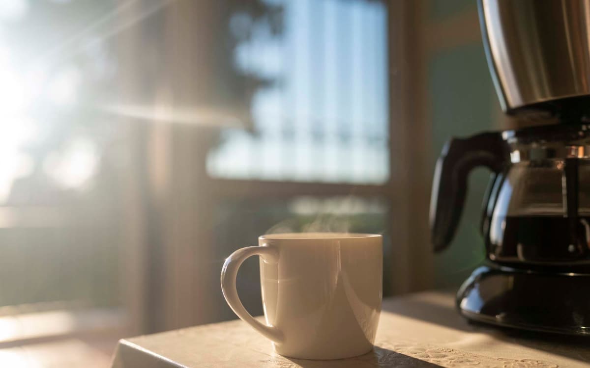 Steaming coffee cup on a table at Mosaico Family Housing in Burien, Washington