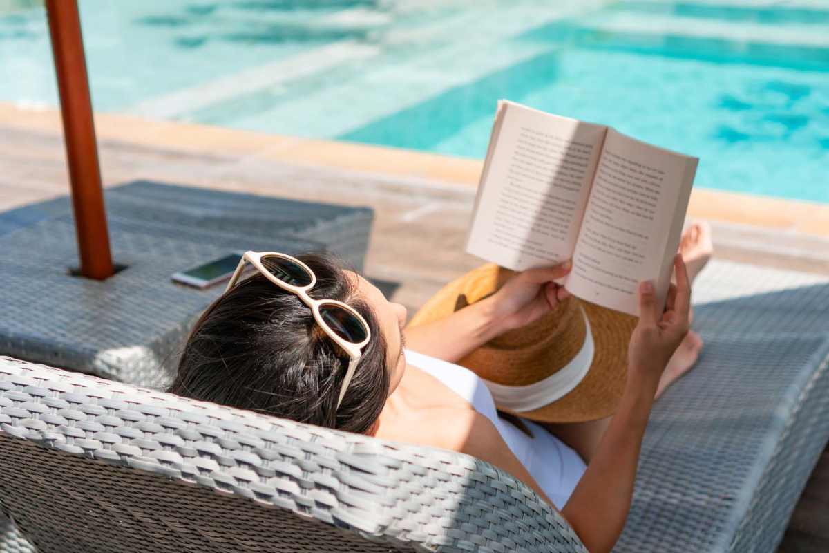Resident relaxing by the pool at Wild Rose Flats in Phoenix, Arizona