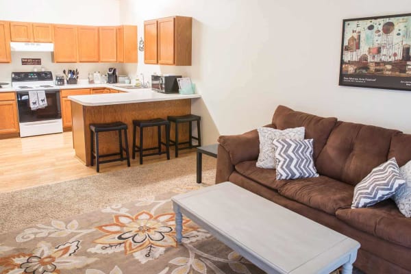 An apartment living room and kitchen at Steinbeck & Twain in Ames, Iowa