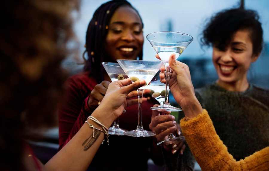 Friends celebrating the moment with drinks at Seapointe Villas in Costa Mesa, California, 