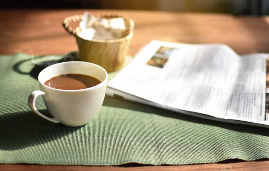 Book and coffee at Park Hacienda Apartments in Pleasanton, California