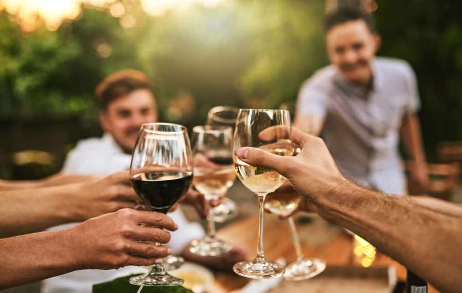 Friends celebrating the moment with drinks at Wasatch Club Apartments in Midvale, Utah,