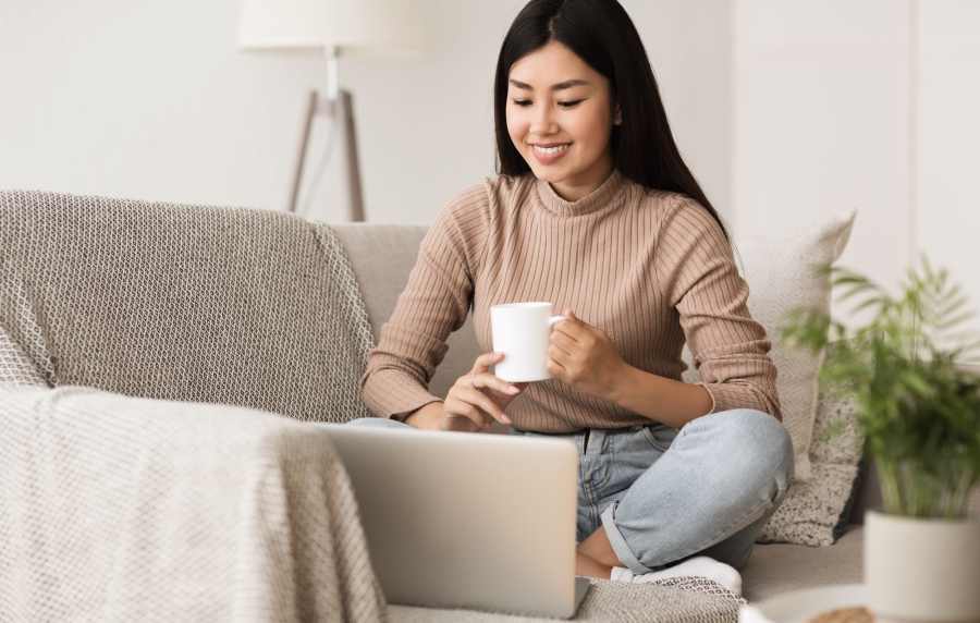 Resident working on her laptop at Broadway Crossing Apartments in Merrillville, Indiana