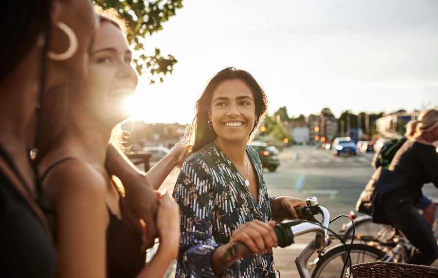 Friends spending time together outdoors near North Road Townhomes in Scottsville, New York