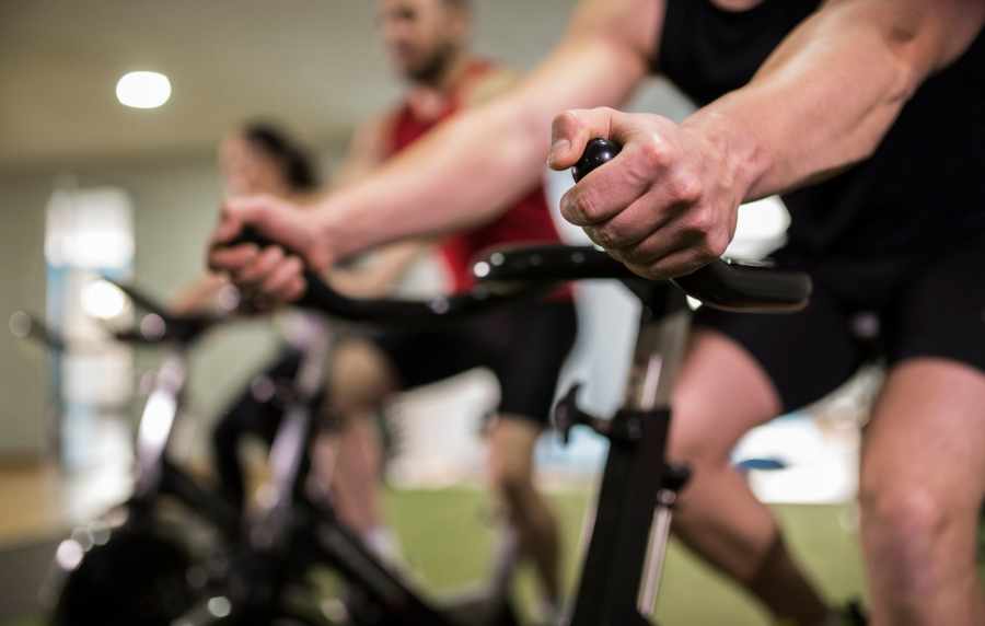 Resident cycling in the gym at Nantucket at Fannin Station in Houston, Texas