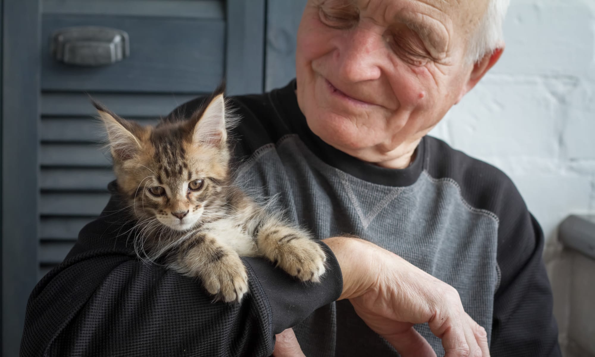 A man and his cat at Broadwell Senior Living in Kearney, Nebraska