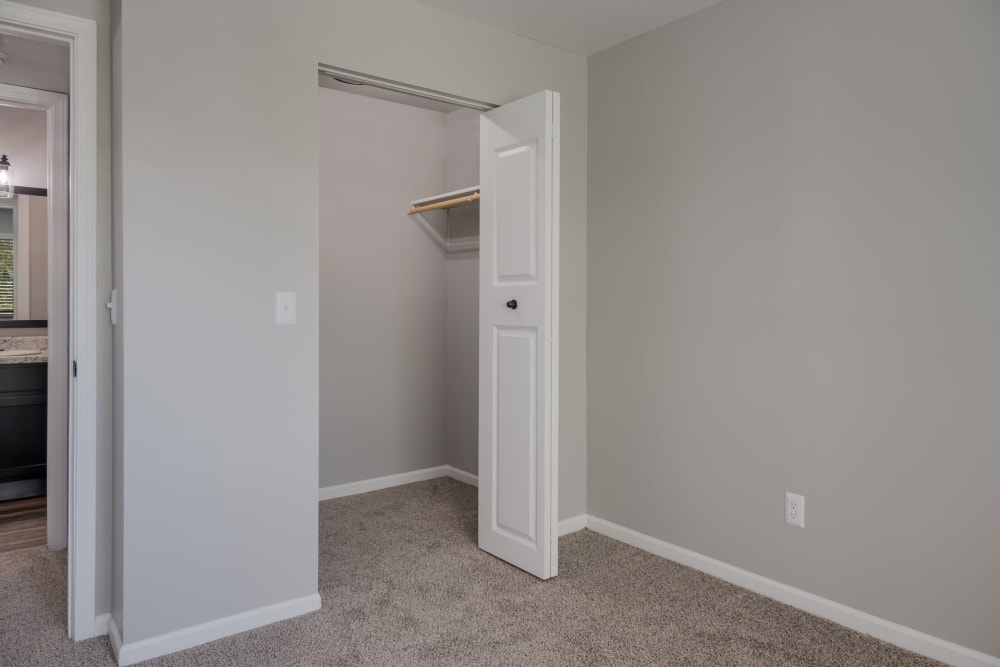 Bedroom with closet at Waters Edge Apartments in Lansing, Michigan