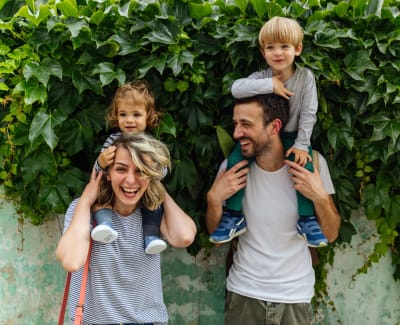 Happy family posing for a photo outside at Sound at Gateway Commons in East Lyme, Connecticut