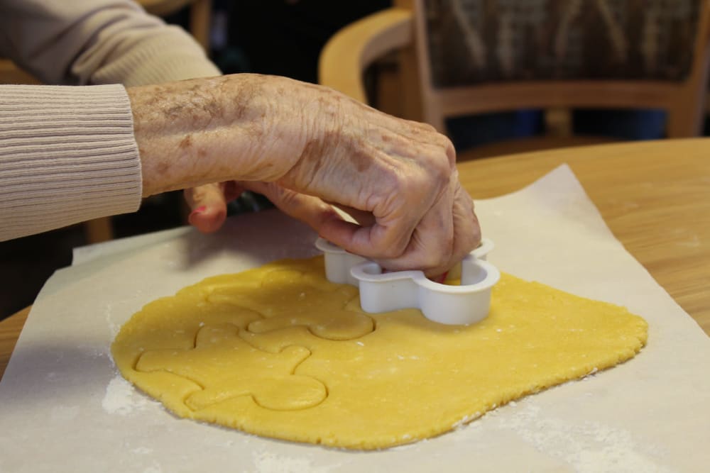 residents making gingerbread man cookies
