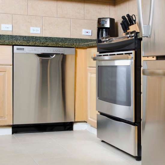 Kitchen with dishwasher at Coral Wood Court in Reseda, California