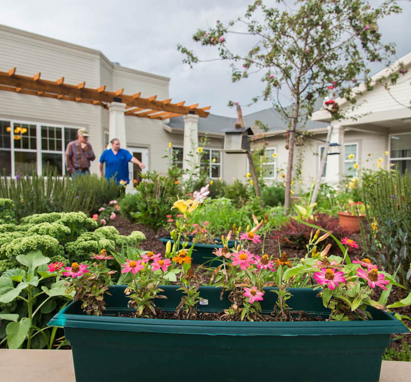 An outdoor walkway between apartments at Touchmark on Saddle Drive in Helena, Montana