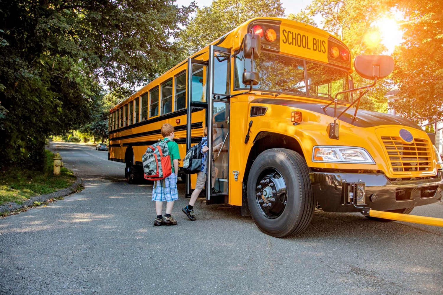 Resident children boarding their school bus near Wakefield Commons in Raleigh, North Carolina
