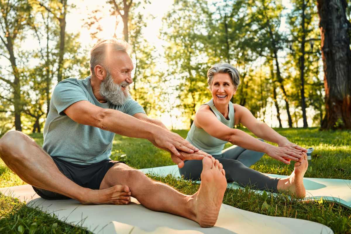 Senior couple doing yoga near Villas At Mesa Ridge in Fountain, Colorado