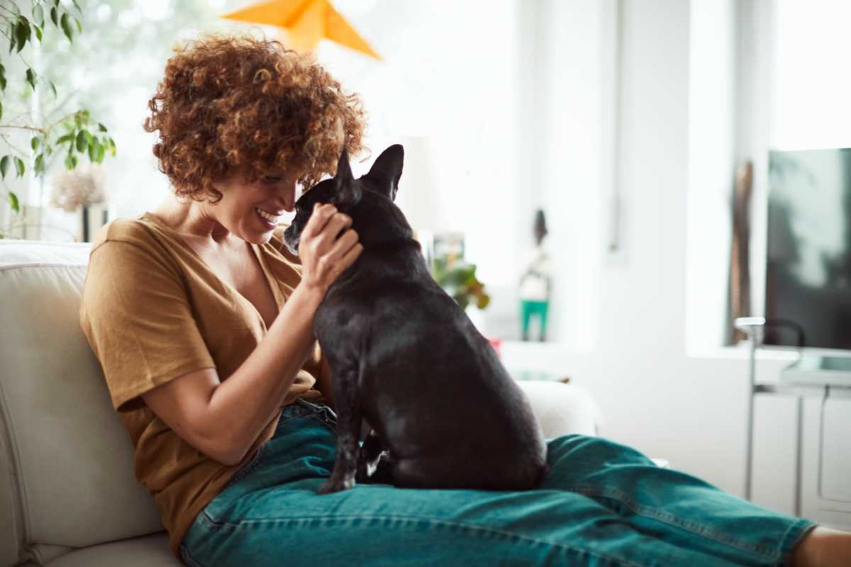 Resident holding her pet at Villas At Bunker Hill, Houston, Texas