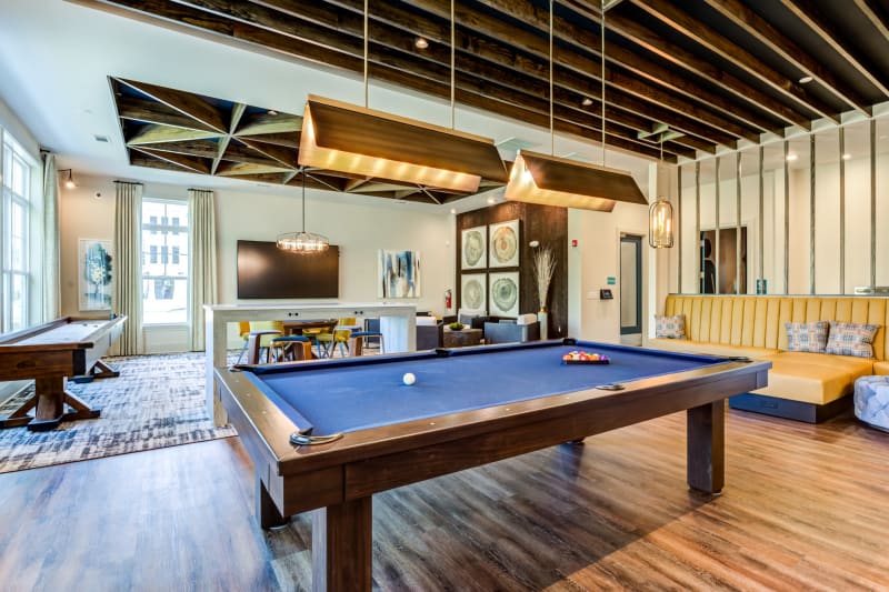 Billiards table and shuffleboard in the resident lounge at Boulders Lakeside in North Chesterfield, Virginia