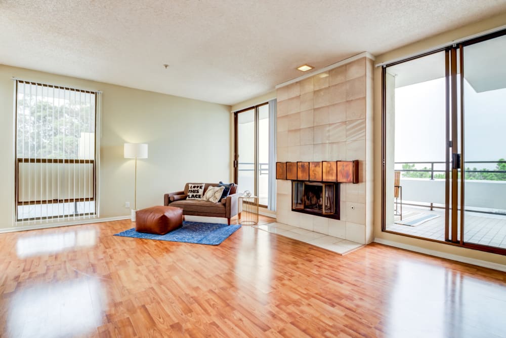 Modern kitchen and hardwood-inspired flooring at Skyline Terrace Apartments in Burlingame, California