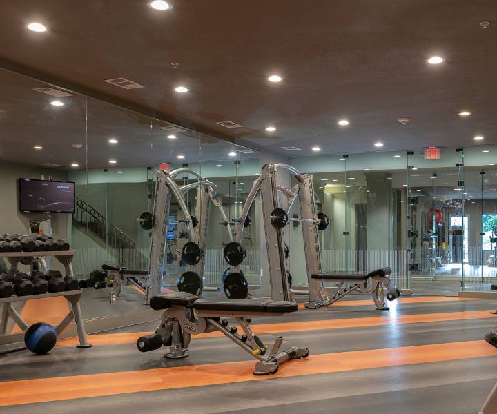 Fully equipped fitness center at Slate At Cole in Dallas, Texas
