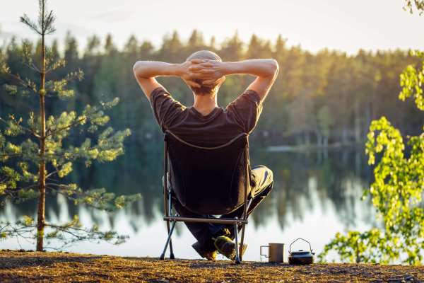 Resident relaxing by the river near Waters Edge in Sacramento, California