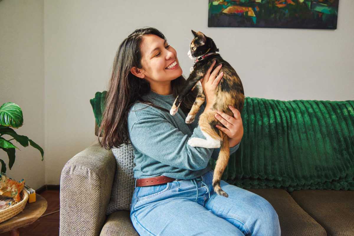 Resident holding her cat at Tierra Linda Apartments in Albuquerque, New Mexico