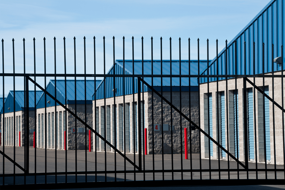 Fenced outdoor storage units at A-American Self Storage in Pomona, California