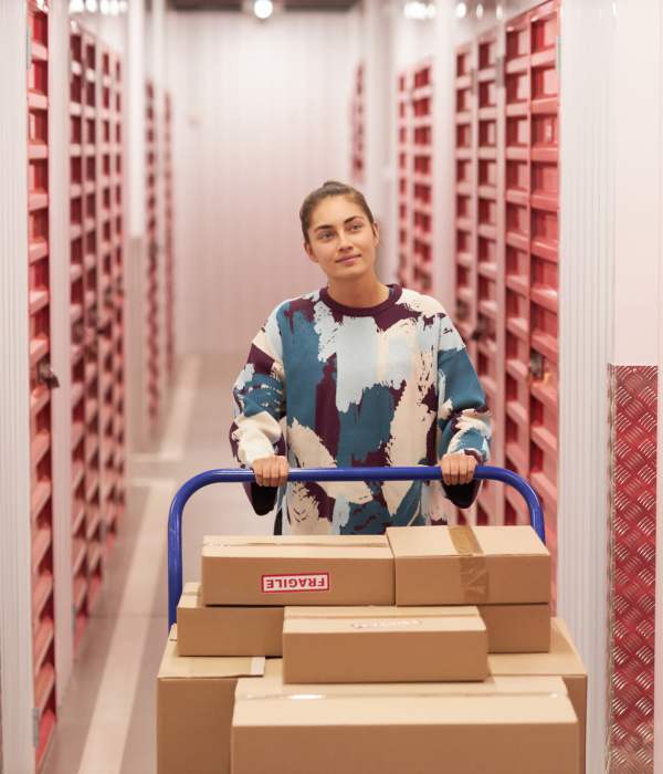 A customer transporting packed boxes at Storage Hub - Guilbeau in San Antonio, Texas
