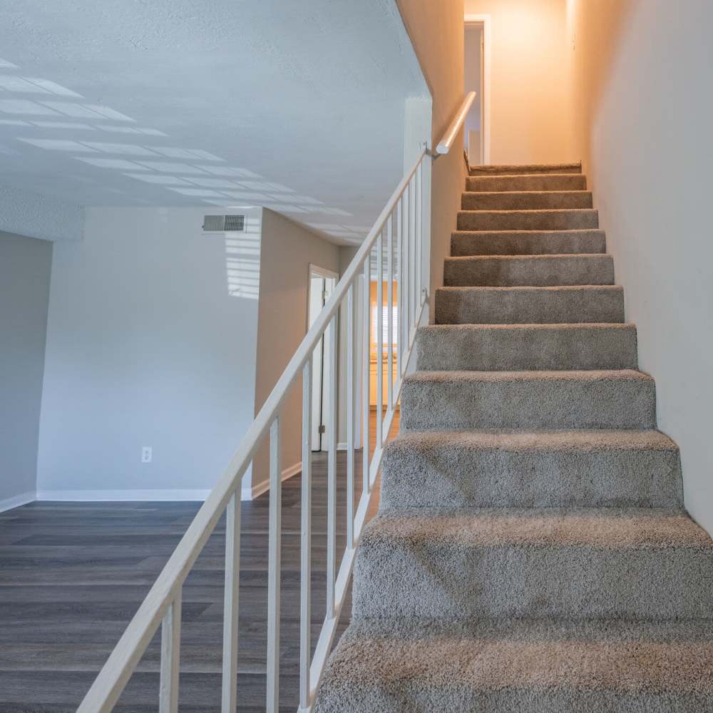 Staircase for upper level at Ivey Ridge Apartments in Graham, North Carolina