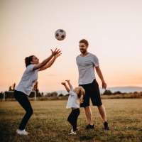 Happy resident playing with his kids at Grapevine Station in Grapevine, Texas