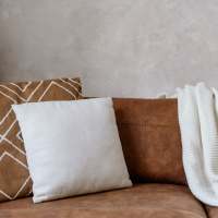 Modern furnishings in a model apartment at Woodchase Apartments in San Leandro, California