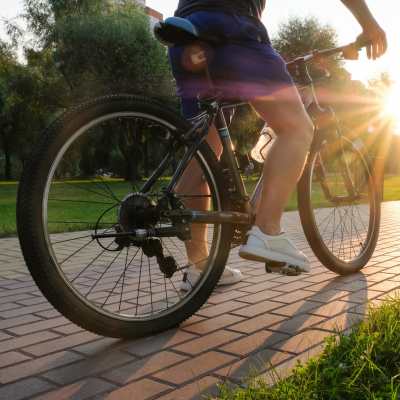 Resident cycling near Ludlam Point in Miami, Florida