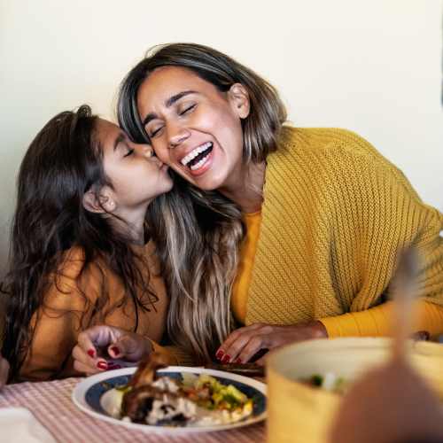 Resident with her kid in a nearby restaurant at Crystal Lake Apartments in Crystal Lake, Illinois