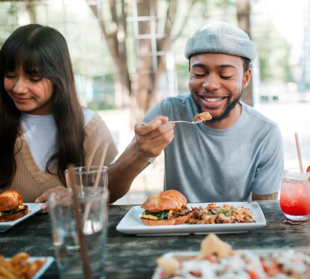 Residents having food in a restaurant nearby at Polly O'Meara Doyle Hall in Santa Rosa, California