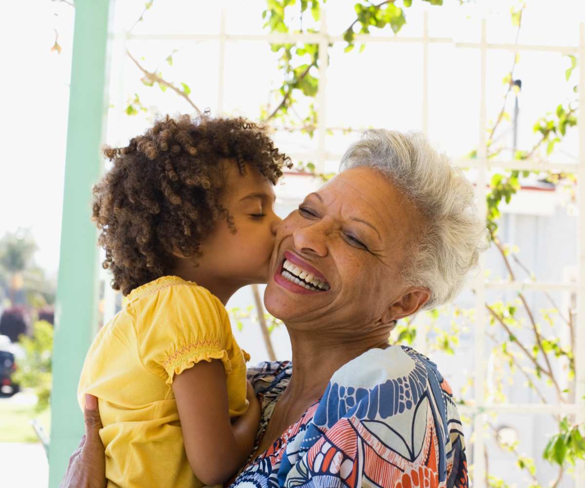 Resident hugging her grandchild at Rosewood Manor Senior Apartments in Edmond, Oklahoma