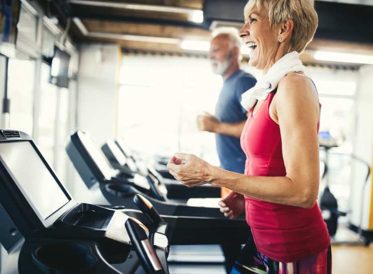 Resident working out in fitness center at The Avenue at Greenmont in Dracut,Massachusetts