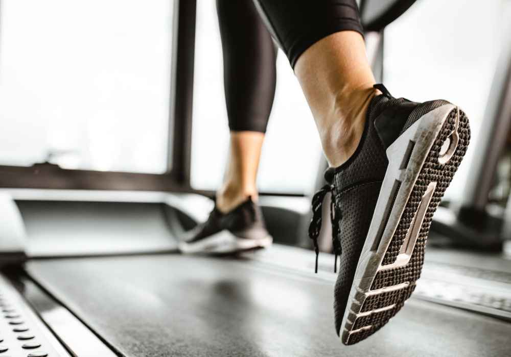 Resident running on the treadmill in the fitness center at Park Vue in Santa Rosa, California