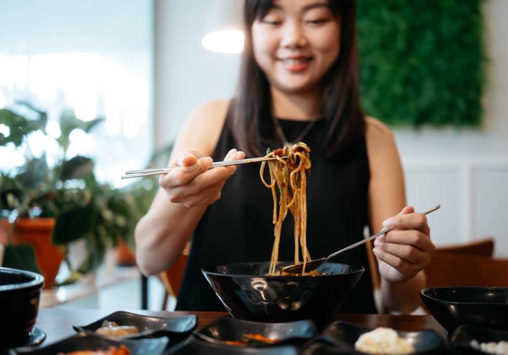 A women having her food at a restaurant near Main Street Apartments in Bensenville, Illinois