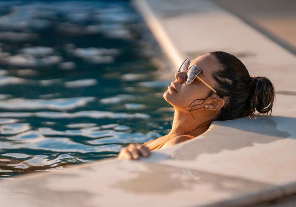 Relaxing by the sparkling pool on a sunny day at Standard at Royal Lane in Dallas, Texas