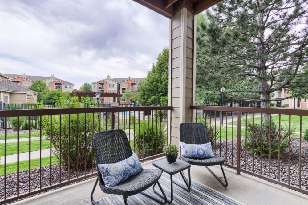 Patio area outside model apartment at Whisper Creek Apartment Homes in Lakewood, Colorado
