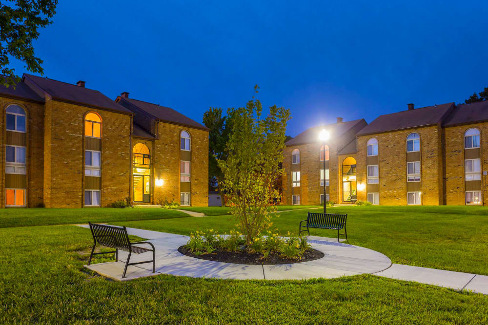 Exterior of Tuscany Gardens Apartments at night in Windsor Mill, Maryland