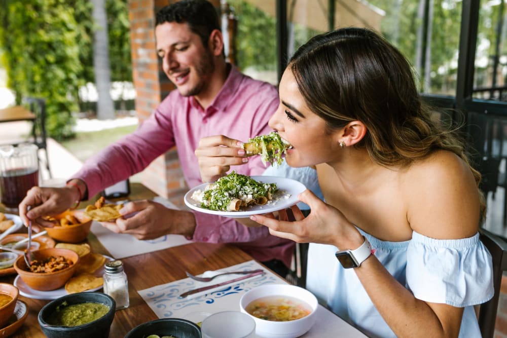 Residents eating a meal outdoors near Park Terrace in High Point, North Carolina