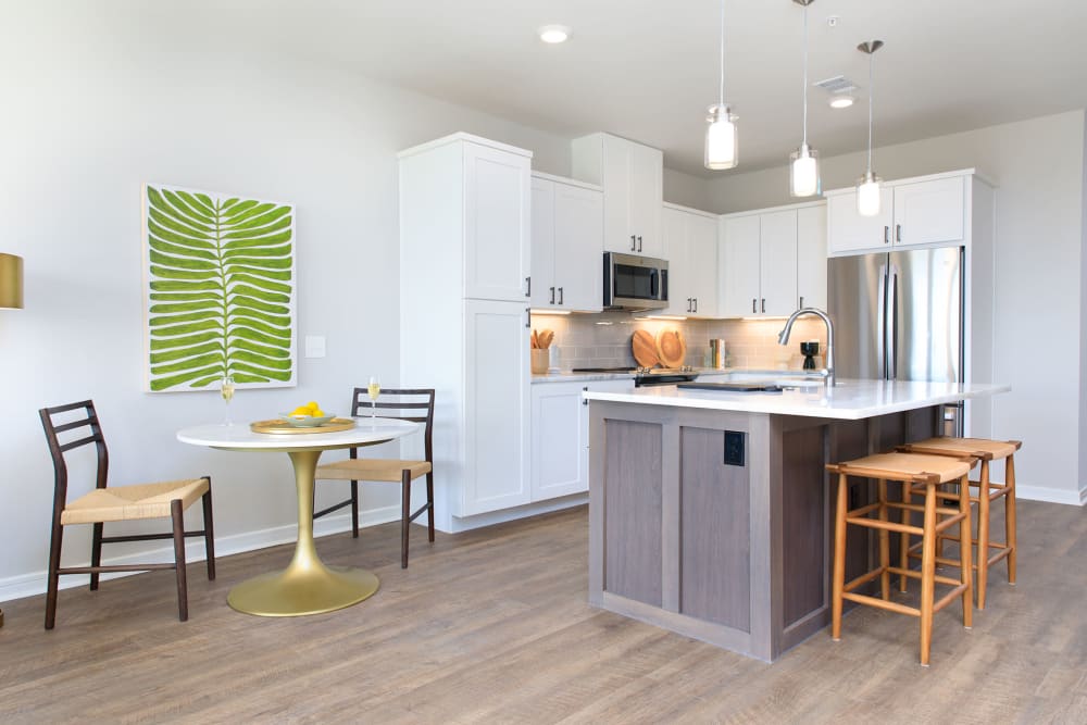 Apartment kitchen and island at Touchmark at Emerald Lake in McKinney, Texas