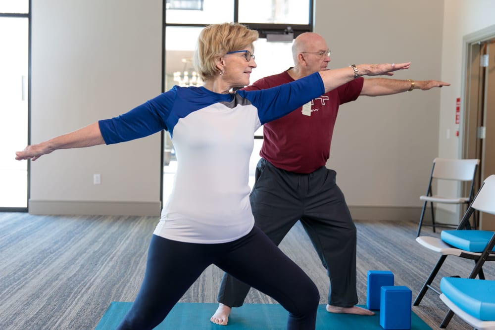 Residence in fitness class at  Touchmark at Emerald Lake in McKinney, Texas 