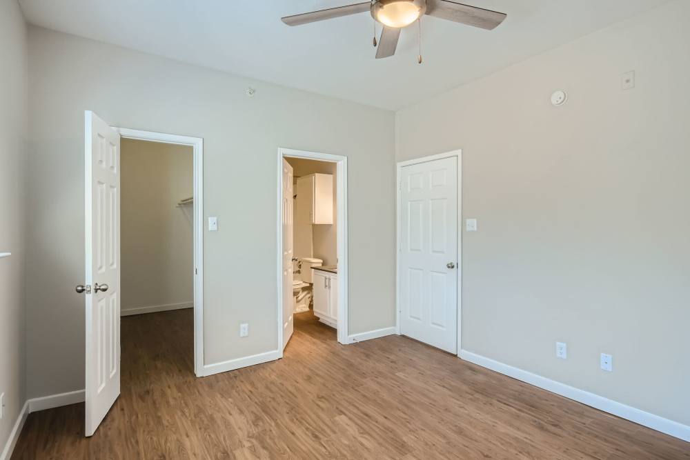 Primary bedroom with bath at Ascent at Lake Worth in Fort Worth, Texas