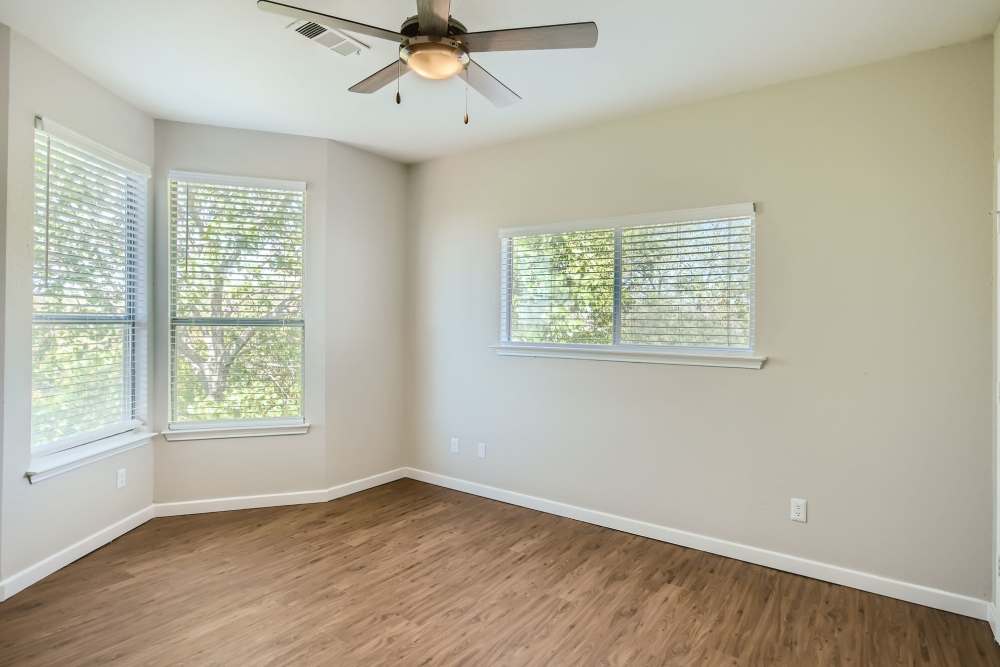 Bright bedroom with hard-wood flooring and windows at Ascent at Lake Worth in Fort Worth, Texas